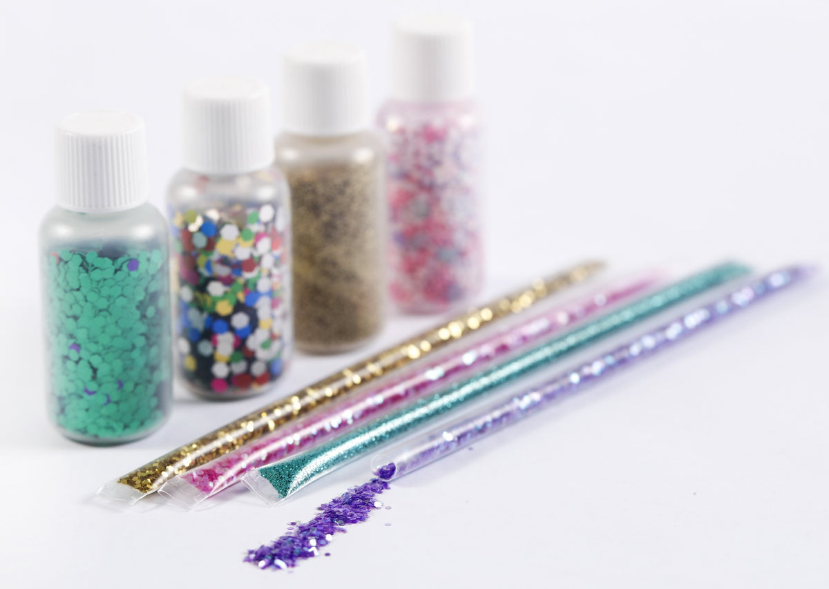 Vials and tubes of glitter for the slime making activity.