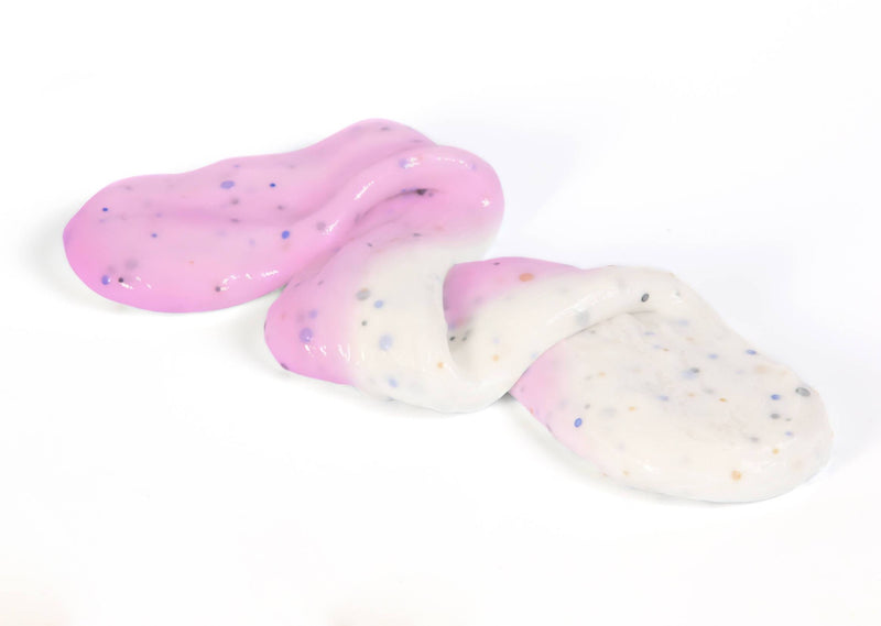 Stretched and folded  Unicorn slime that changes from white to pink in the sunlight
