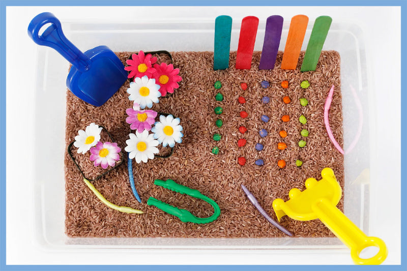 Super Easy Winter Rice Sensory Bin - Happy Toddler Playtime