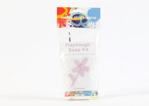 Single package of the Lavender color of Messy Play Kit's playdough soap DIY kit. Label shows a flower molded from the purple playdough soap.