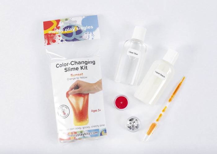 Packaging and contents of a Sunset slime kit, including a glue bottle, liquid starch bottle, glitter, and color-changing pigment that changes the slime from orange to yellow based on temperature.