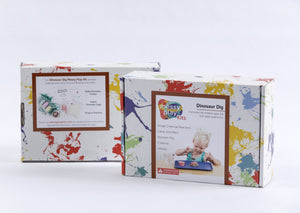 Splatter painted box package of Dinosaur Dig Messy Play Kit, showing front and back of package.