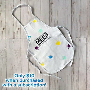 White apron with colorful splatter design and text reading "Professional Mess Maker" and "www.messyplaykits.com"