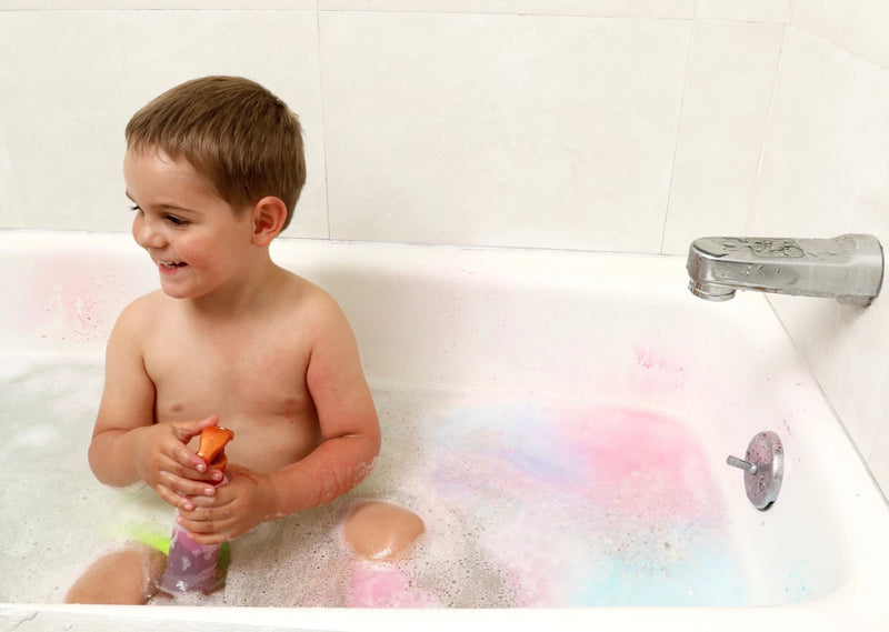 Child in bathtub playing with spray bottle from Bath Tub Fun Messy Play Kit
