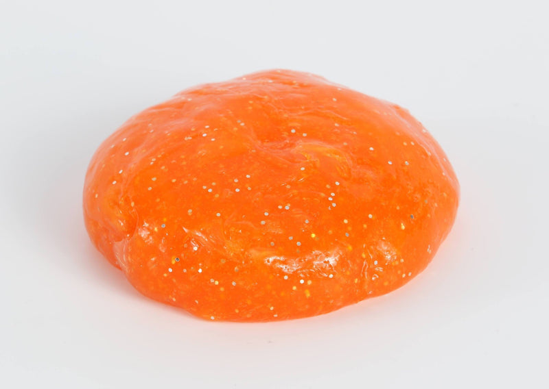 Round ball of orange glitter slime by Messy Play Kits.