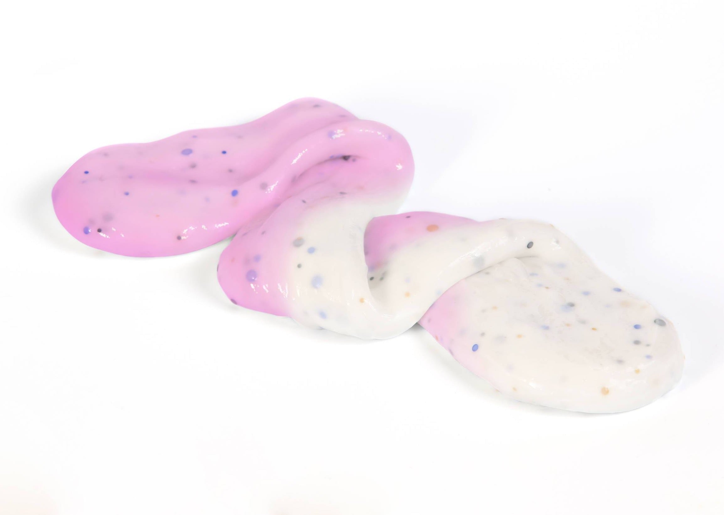 Stretched and folded  Unicorn slime that changes from white to pink in the sunlight