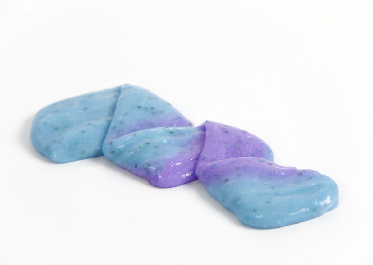 Stretched and folded Mermaid slime that changes from blue to purple in the sunlight
